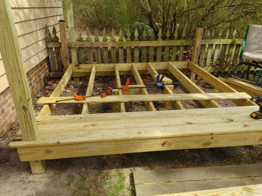 4x4's in cement middle support x 2 plus 4 on coners